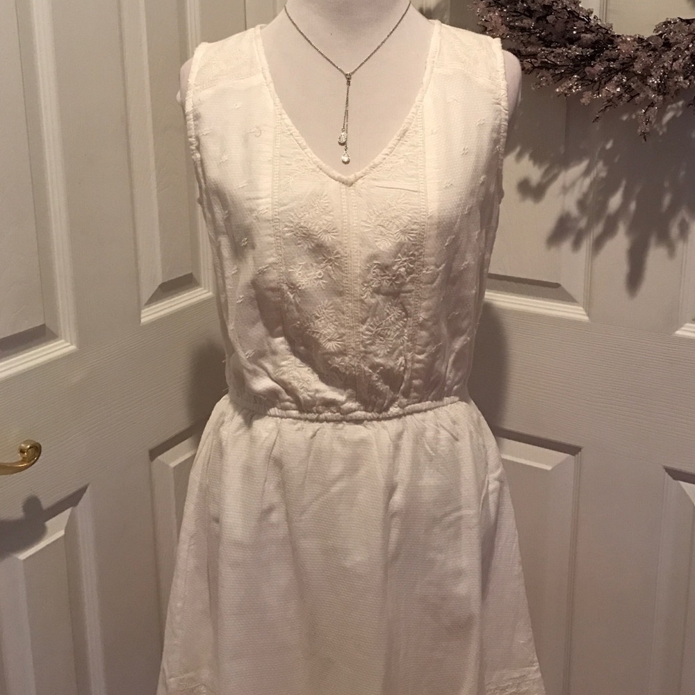 Cream colored sleeveless fully lined dress